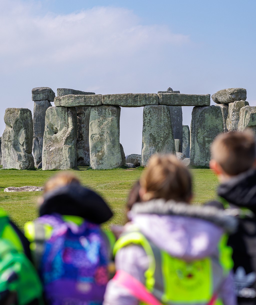 Back of school group facing toward Stonehenge