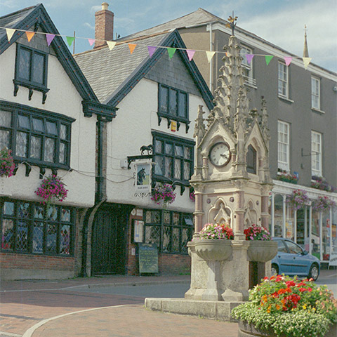 A memorial and old Tudor-looking buildings in Great Torrington