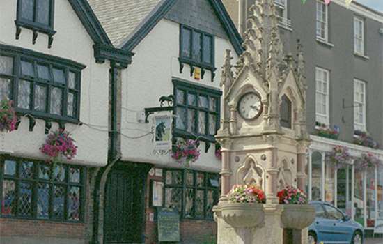 A memorial and old Tudor-looking buildings in Great Torrington